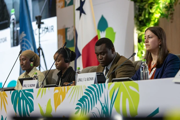 Brenda Mazumba as a rapporteur during her group's presentation (second from left)